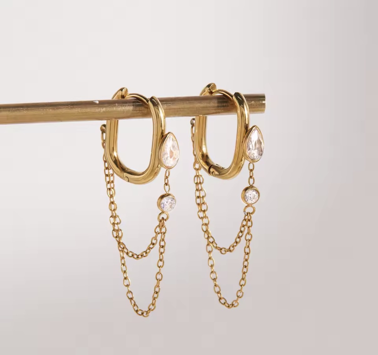 Oval Huggie Gold Hoop Earrings with Crystal Chain Dangles